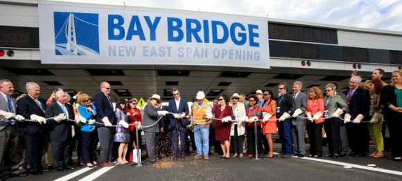 State and local officials join California Lt. Governor Gavin Newsom to open the East Span by  re-enacting the chain cutting that marked the opening of the original Bay Bridge in 1936. (Photo courtesy of Caltrans)